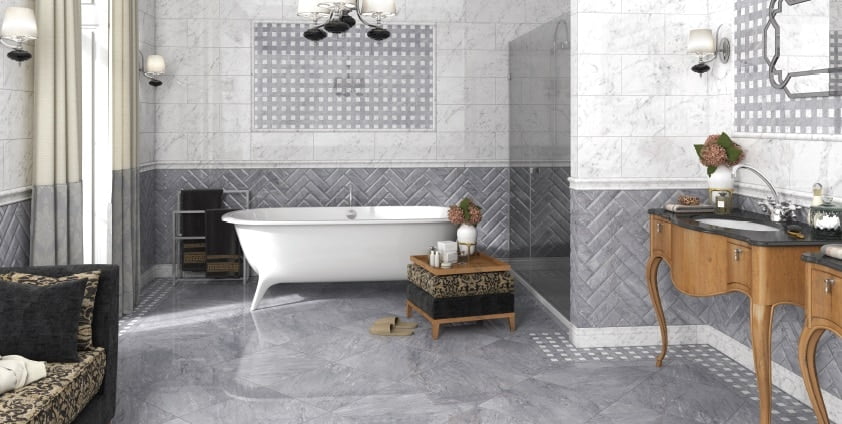 Elegant marble bathroom with grey and white tiles and matching grout colors 