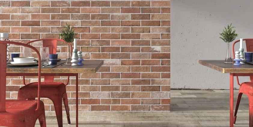 Brick accent wall tiles in pale red colors with white grout color to contrast