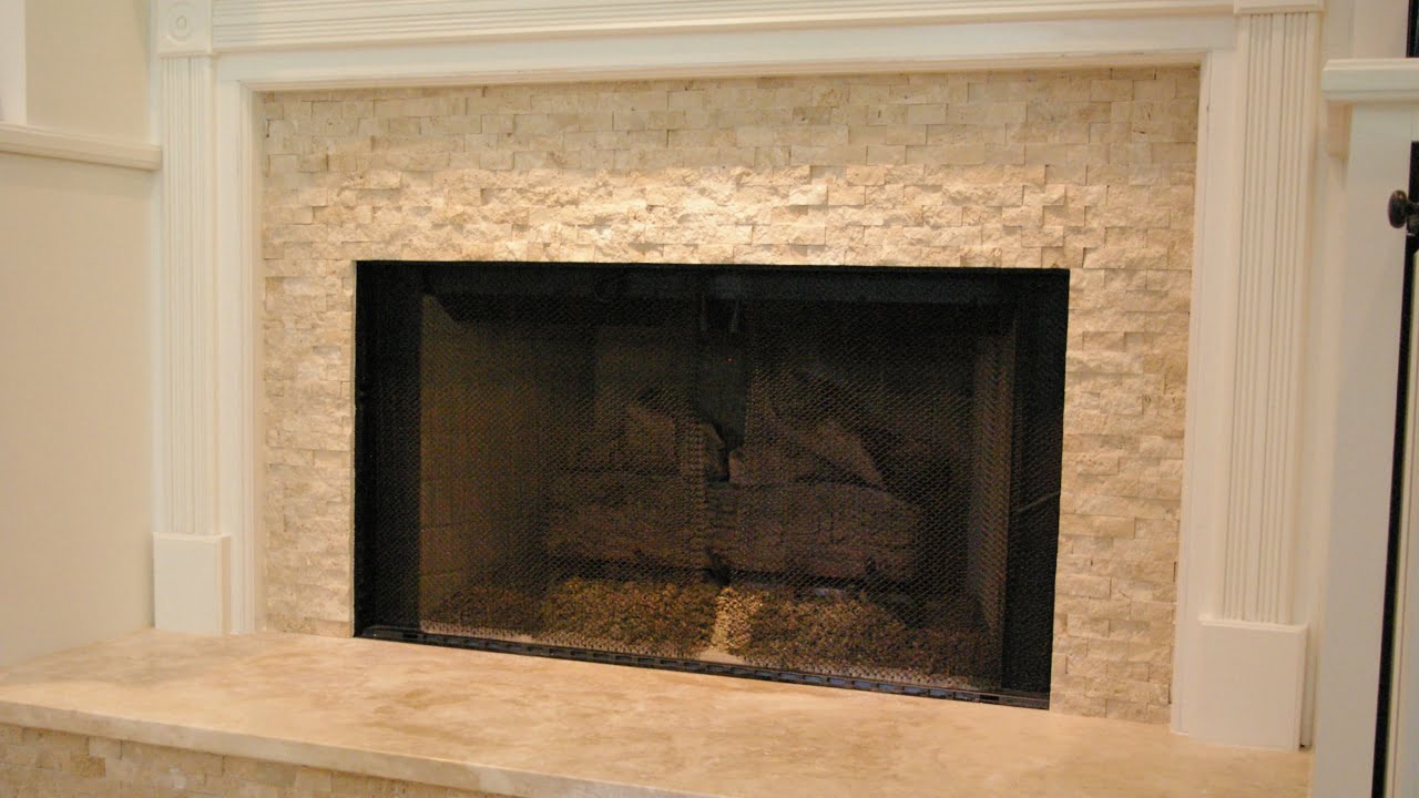 Small stone mosaic mesh used to reface a marble fireplace