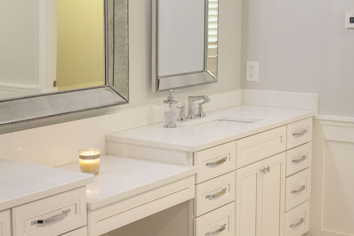 Master bathroom white vanity with countertop and mirror